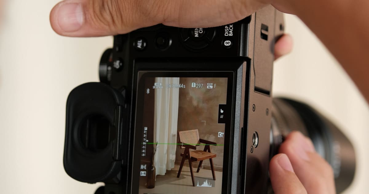 A photographer checking the shot on the camera’s rear screen