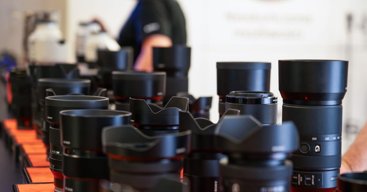 A collection of cameras and lenses arranged together