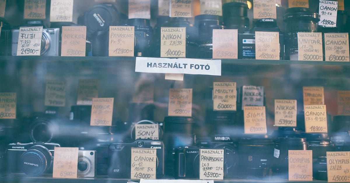 Cameras behind glass in a shop showcase